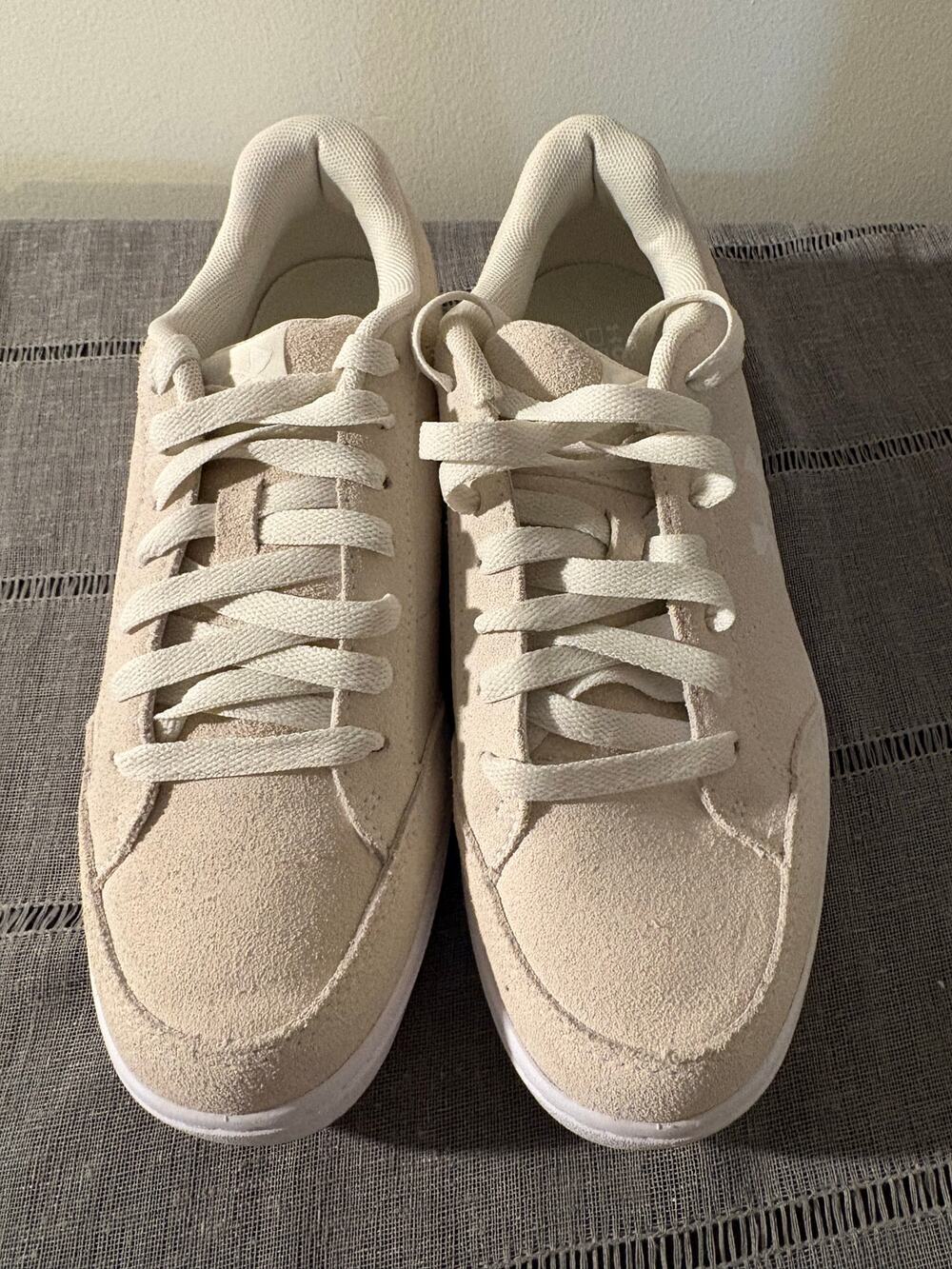 Women’s Under Armour size 8 off white Suede tennis shoes with gummy soles.